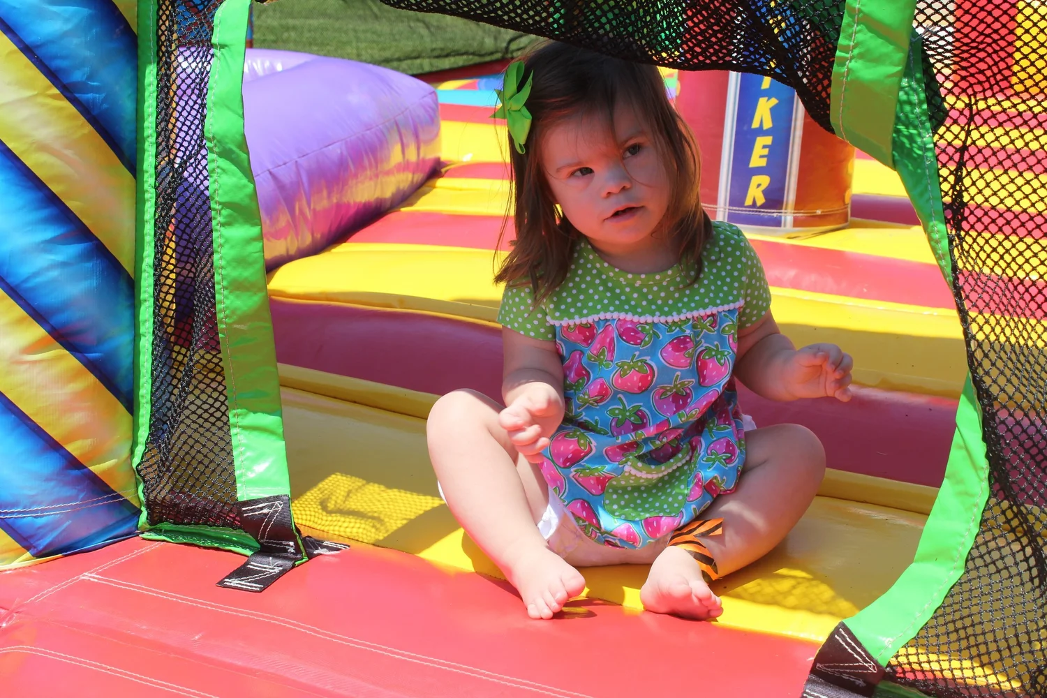 A child exploring a brightly colored inflatable at a previous DAFF