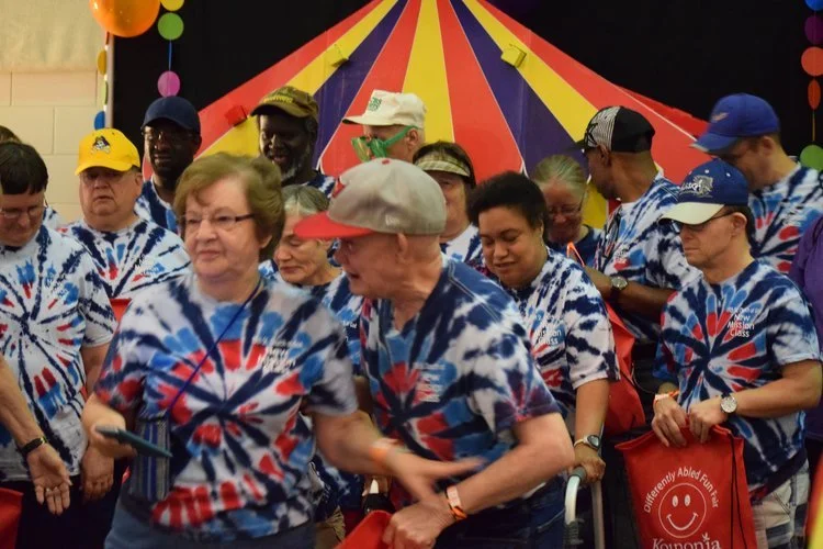 DAFF guests gathered in coordinated tie-dye shirts at a past fair